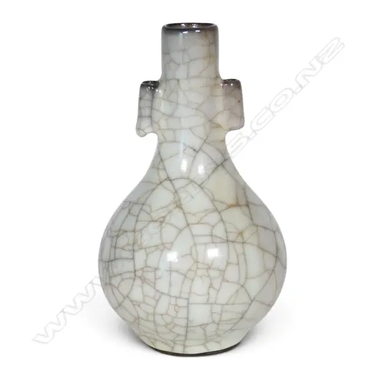 A Chinese crackle celadon glaze bottle form vase,
