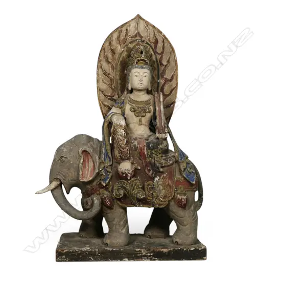 An antique carved polychrome Bodhisattva of compassion,