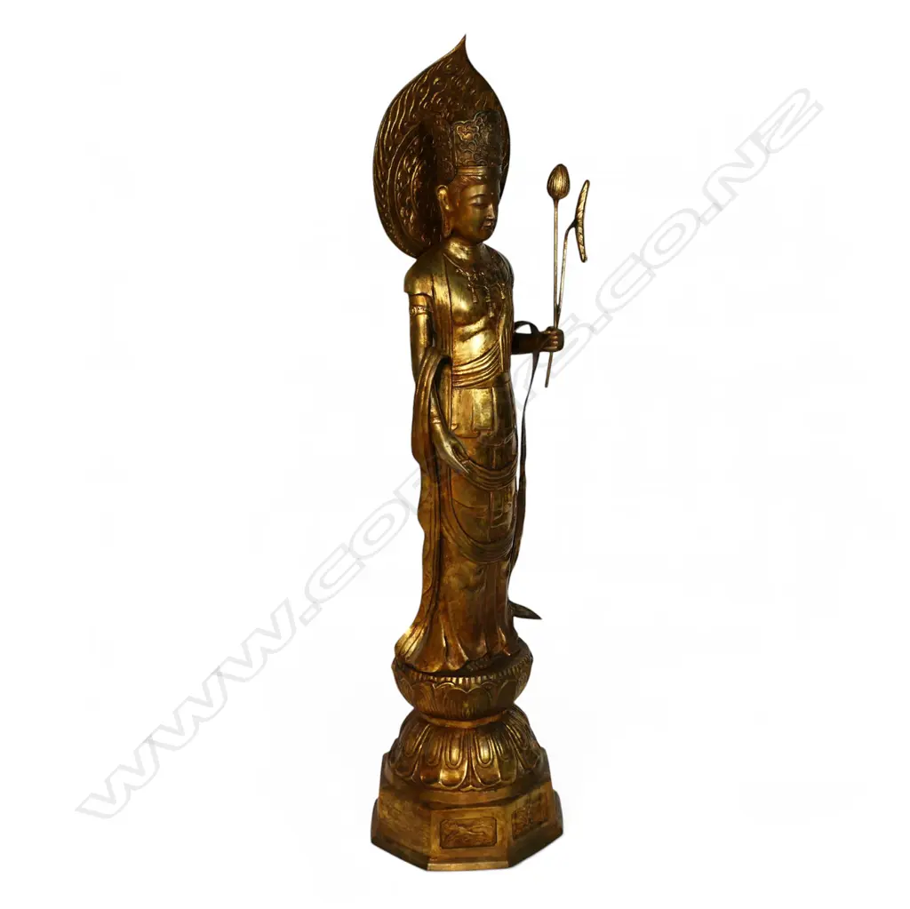 A large floor standing gilt bronze figure of Kuanyin, Image 1++
