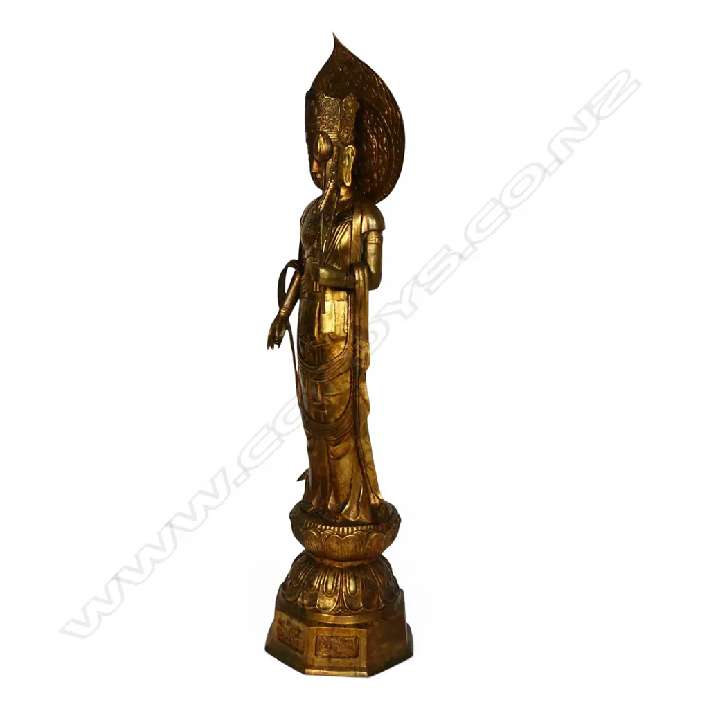 A large floor standing gilt bronze figure of Kuanyin, Image 1++