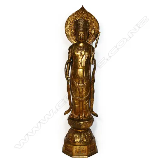A large floor standing gilt bronze figure of Kuanyin,
