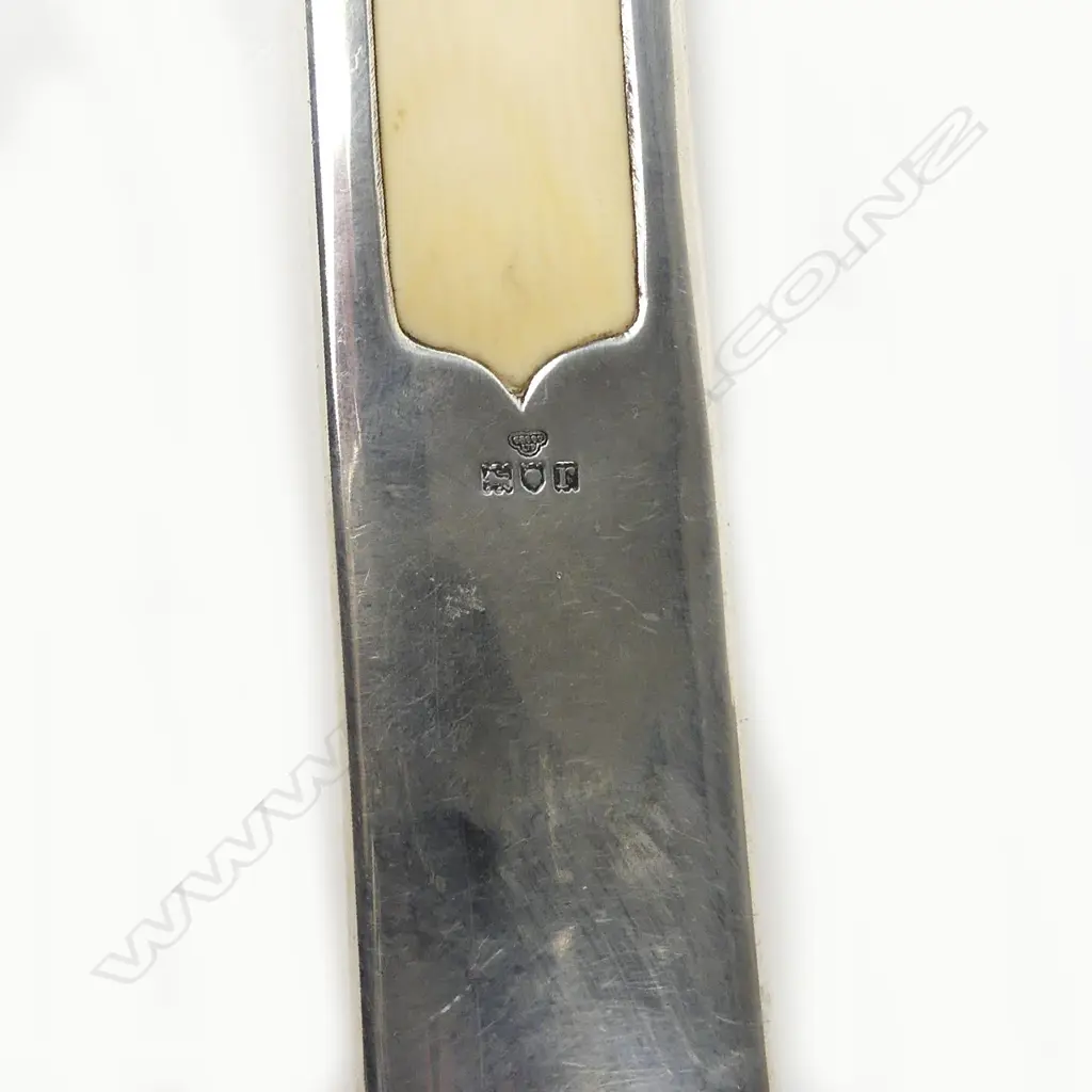 An early 20thC silver handled long ivory paper knife, Image 1++