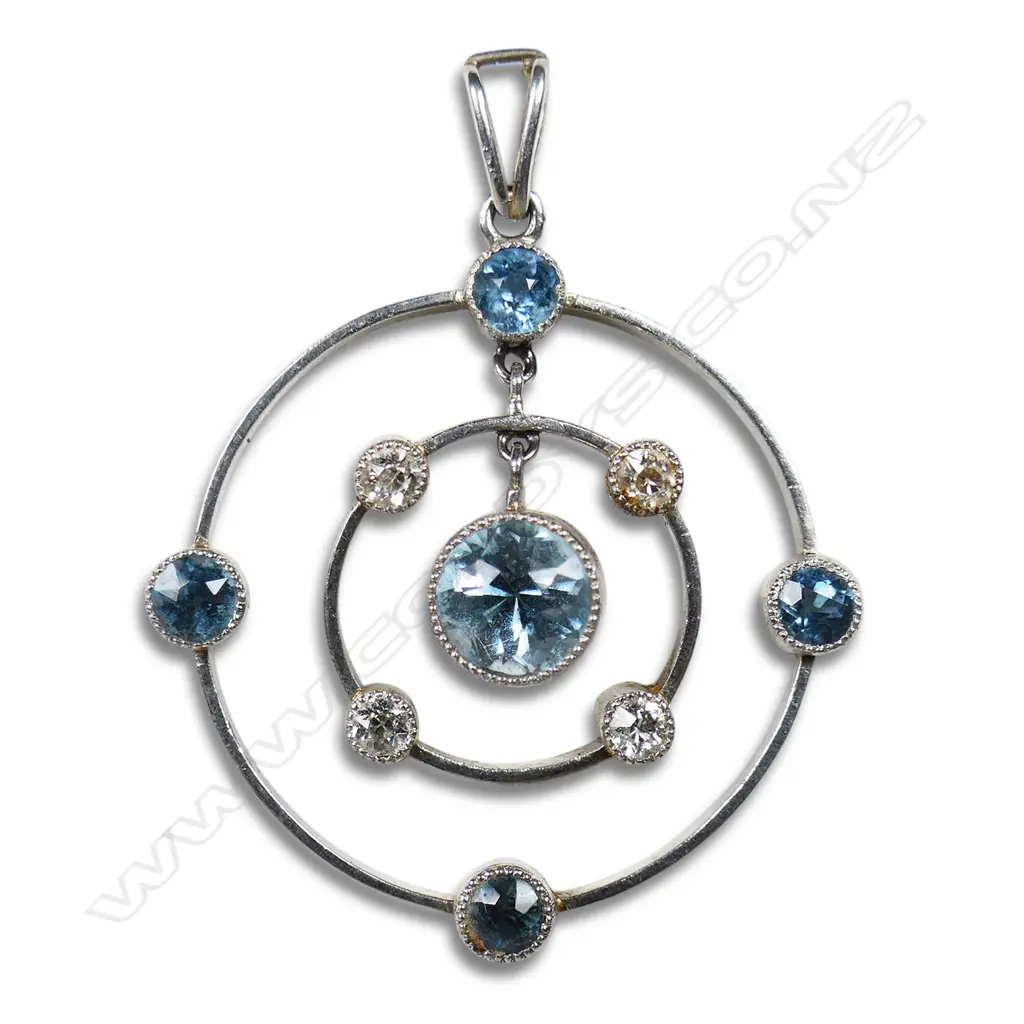 A platinum diamond and aquamarine pendant, Image 1++