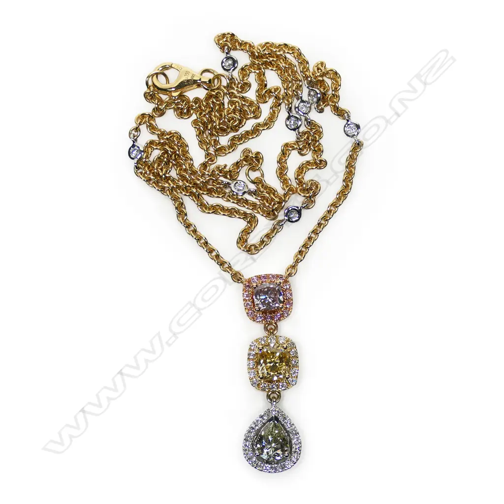 An 18ct white rose and yellow gold graduated shaped diamond drop necklace, Image 1++