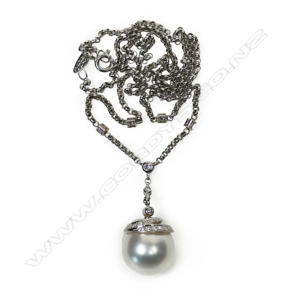 An 18ct white gold pearl and diamond pendant, Image 1++