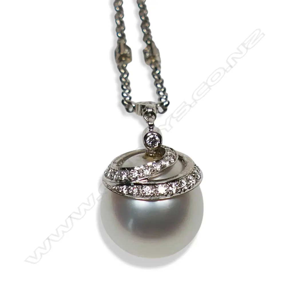 An 18ct white gold pearl and diamond pendant, Image 1++