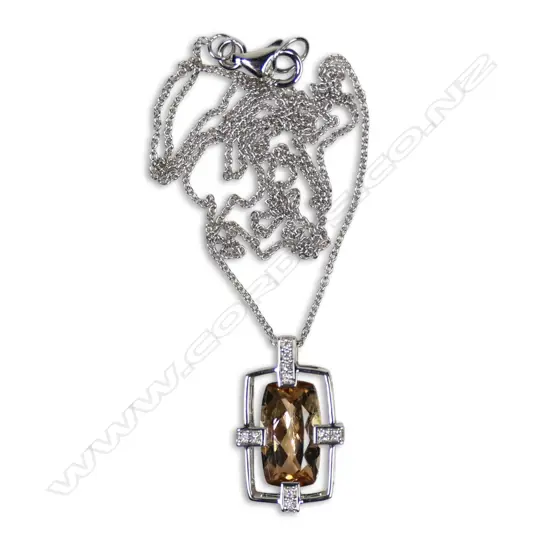 A 14ct white gold peach tourmaline and diamond pendant necklace,