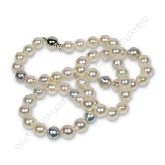A uniform white cultured semi-baroque pearl necklace,