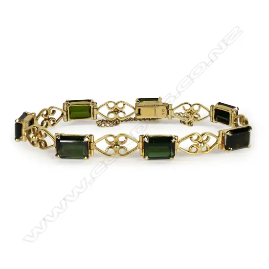 A traditional 18ct yellow gold and seven green tourmaline bracelet,