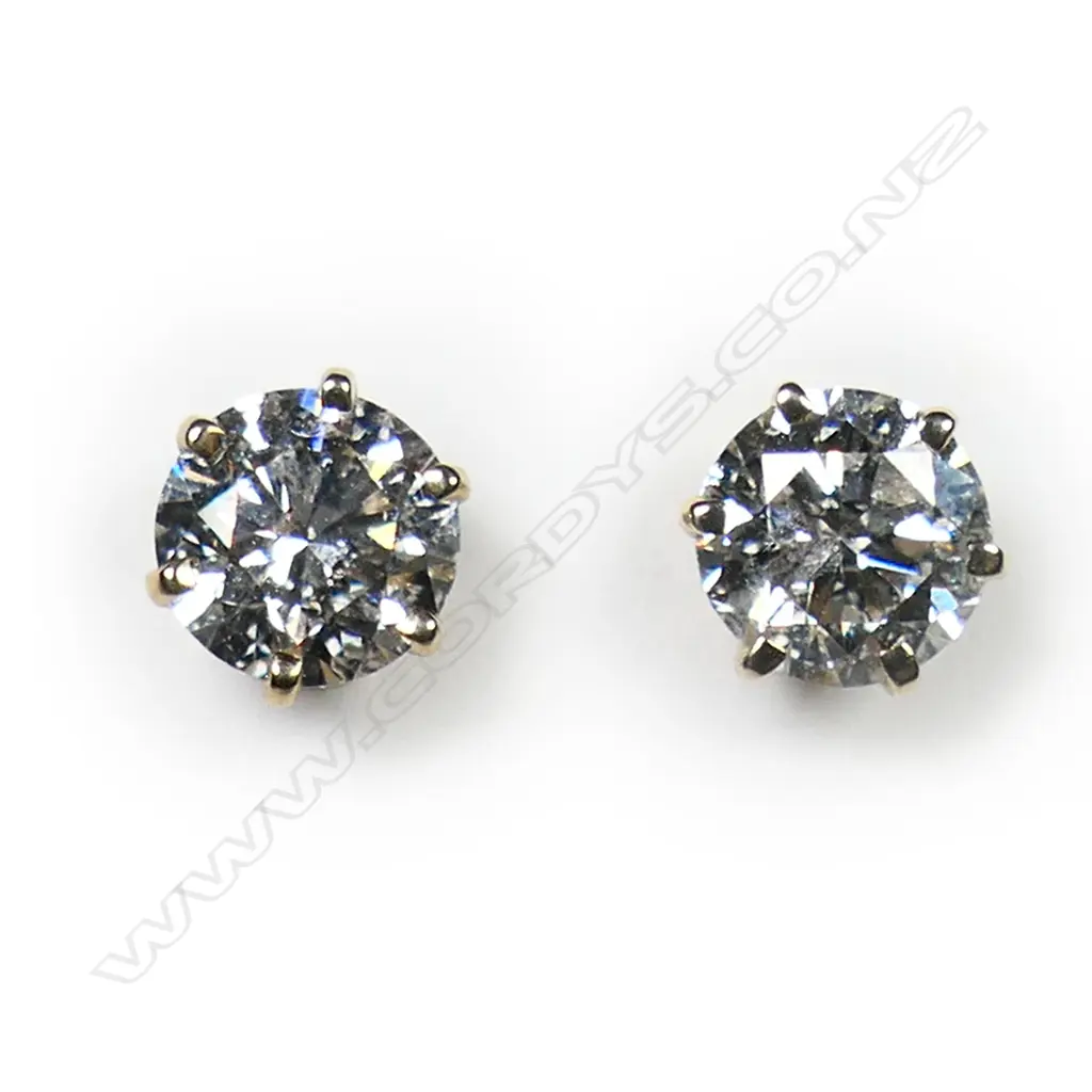 A pair of 14ct gold and diamond stud earrings, Image 1++