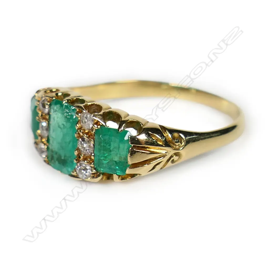 An estate 18ct gold emerald and diamond ring, Image 1++