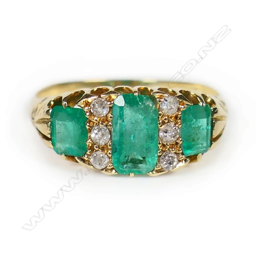An estate 18ct gold emerald and diamond ring, Image 1++
