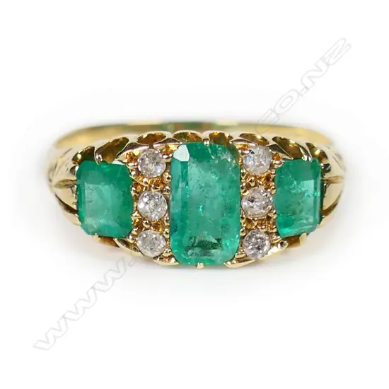 An estate 18ct gold emerald and diamond ring,