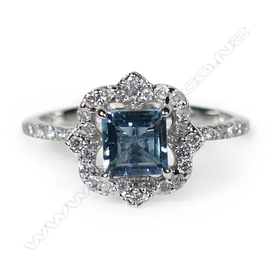 A 14ct white gold Santa Maria aquamarine and diamond halo ring,