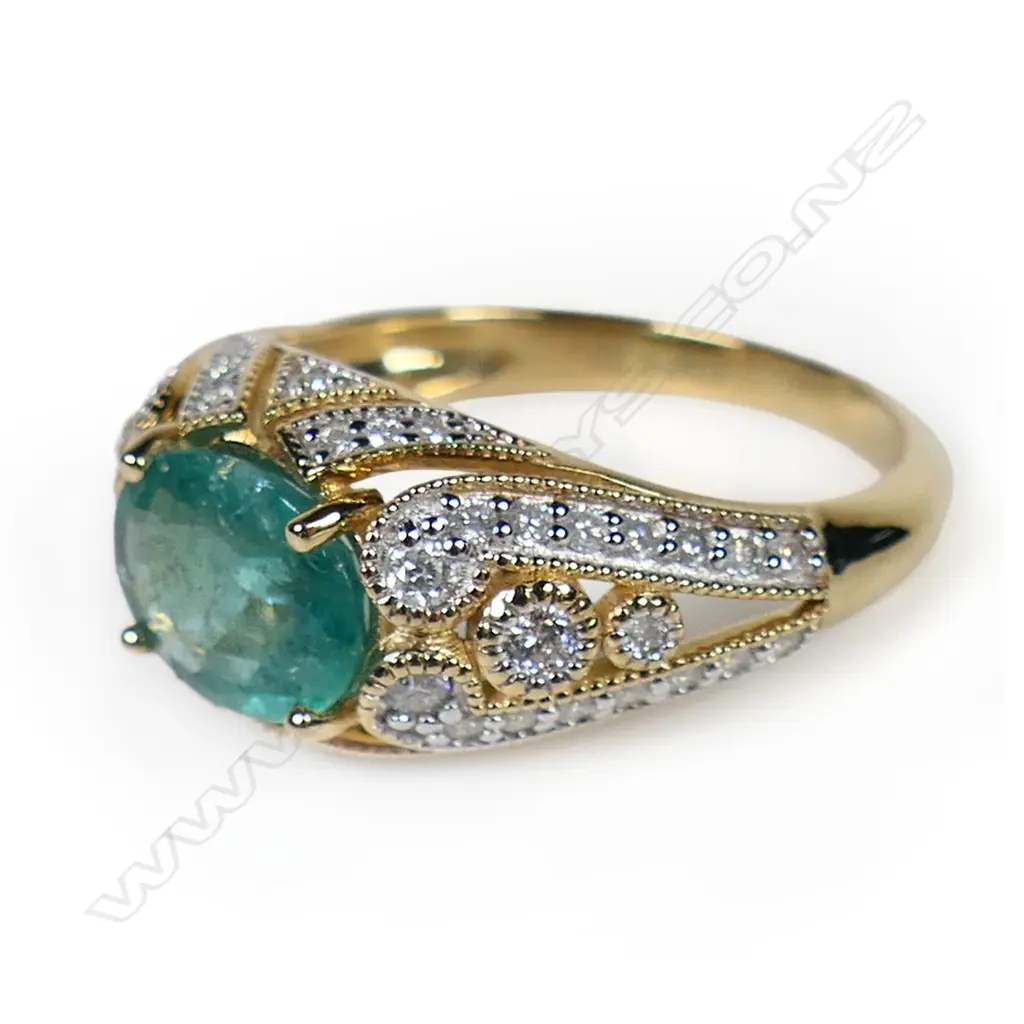 A 14ct gold emerald and diamond dress ring, Image 1++