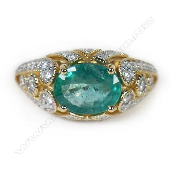 A 14ct gold emerald and diamond dress ring,