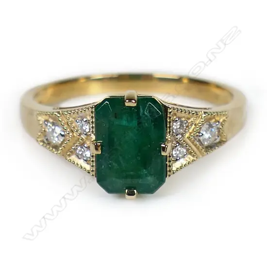 A 14ct gold emerald and diamond ring,