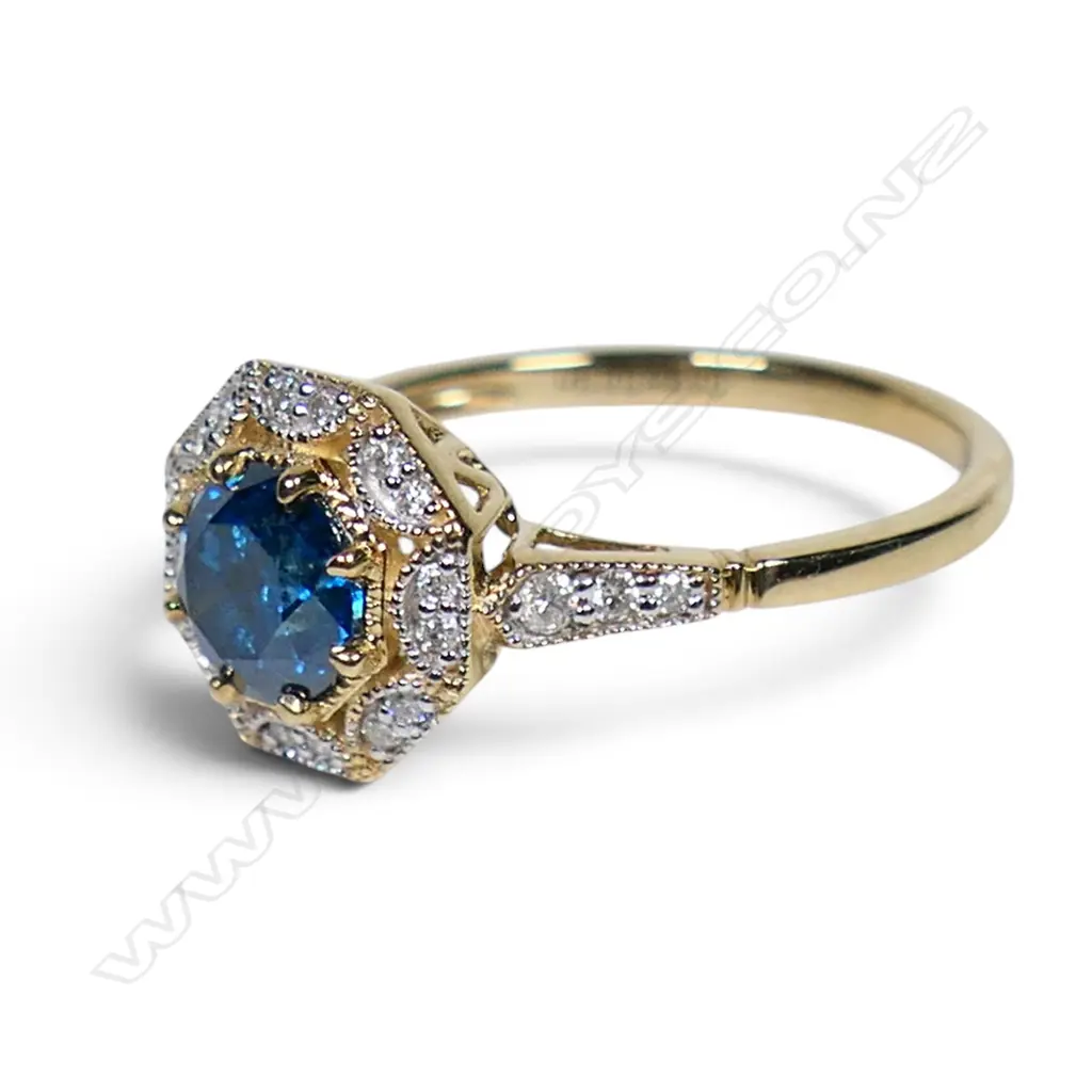 A 14ct gold blue and white diamond halo ring, Image 1++