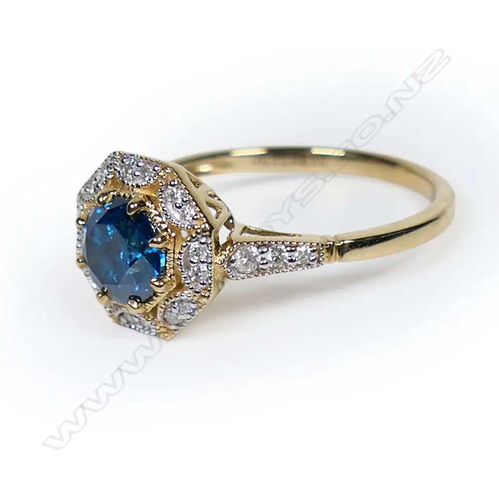 A 14ct gold blue and white diamond halo ring, Image 1++