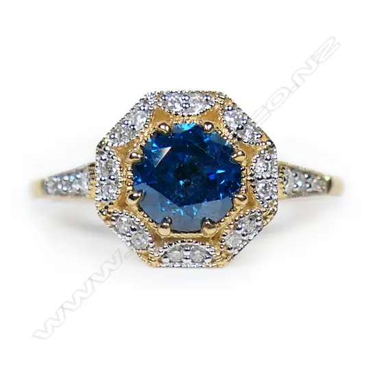 A 14ct gold blue and white diamond halo ring,