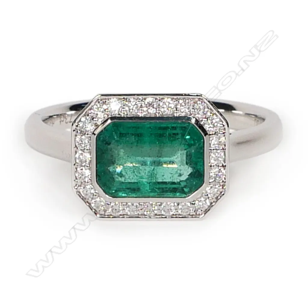 An 18ct white gold emerald and diamond ring, Image 1++