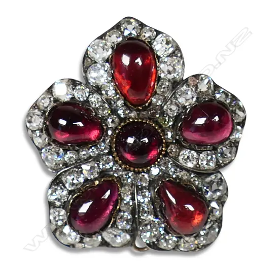 A Victorian 9ct rose gold and silver garnet and diamond brooch,