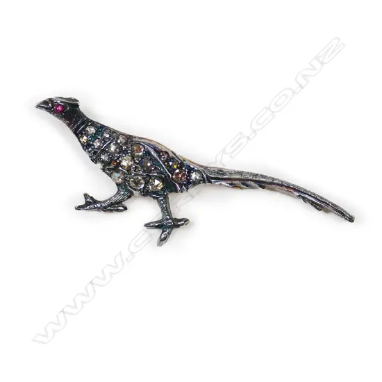 A silver gilt diamond set pheasant brooch,