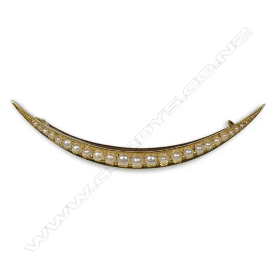 An Edwardian 15ct gold and pearl crescent brooch,