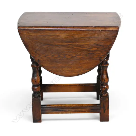 A 19thC Elizabethan style small proportion oak drop leaf table,