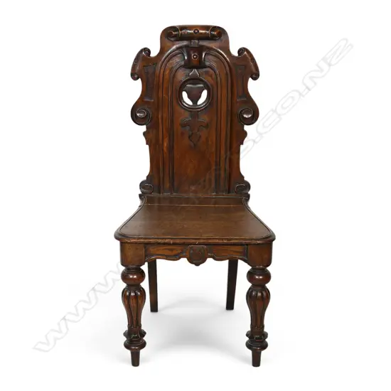 A Victorian oak hall chair,