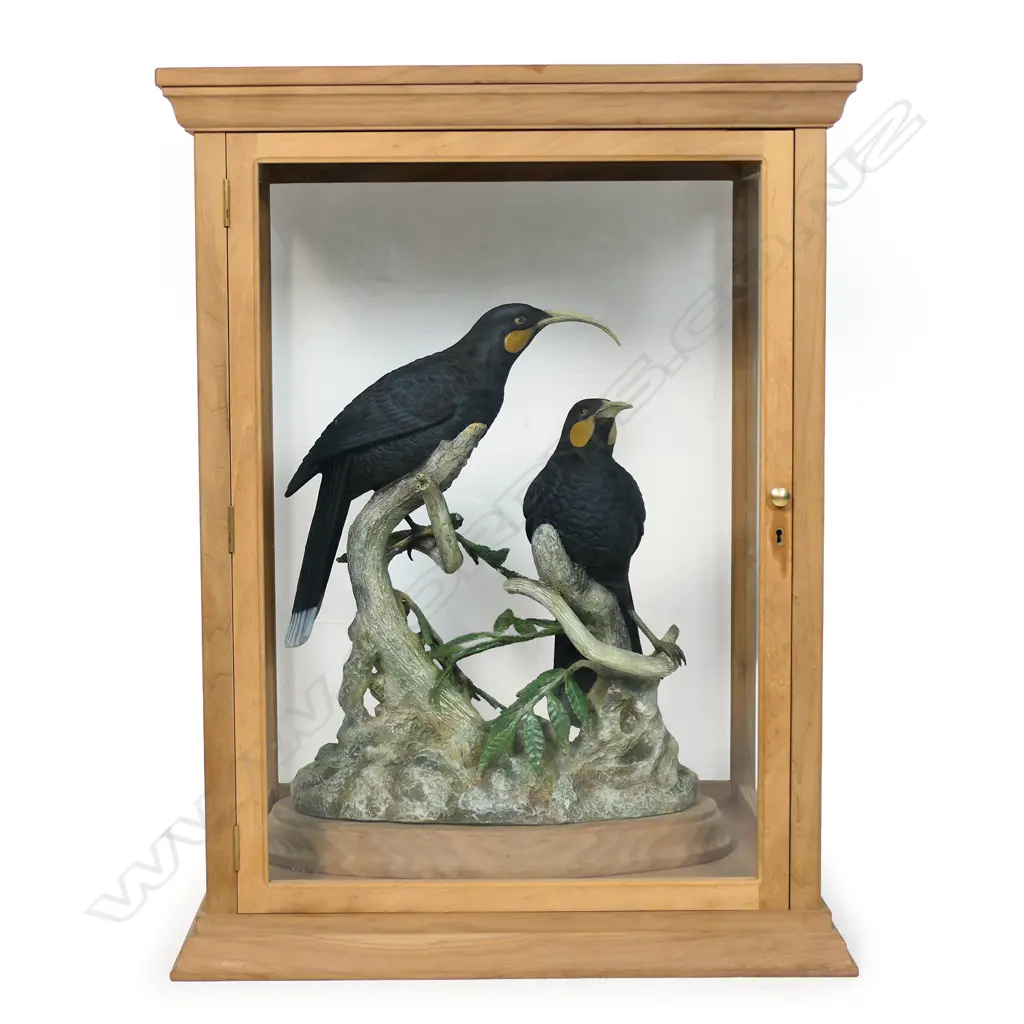 A pair of contemporary sculpted resin huia birds on naturalistic branch trunk base, Image 1++