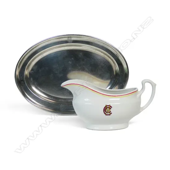 Two MCC monogrammed Lords dining room items - a Churchill pottery gravy boat and Mappin & Webb silver plate oval sandwich plate - 260 mm x 185 mm.