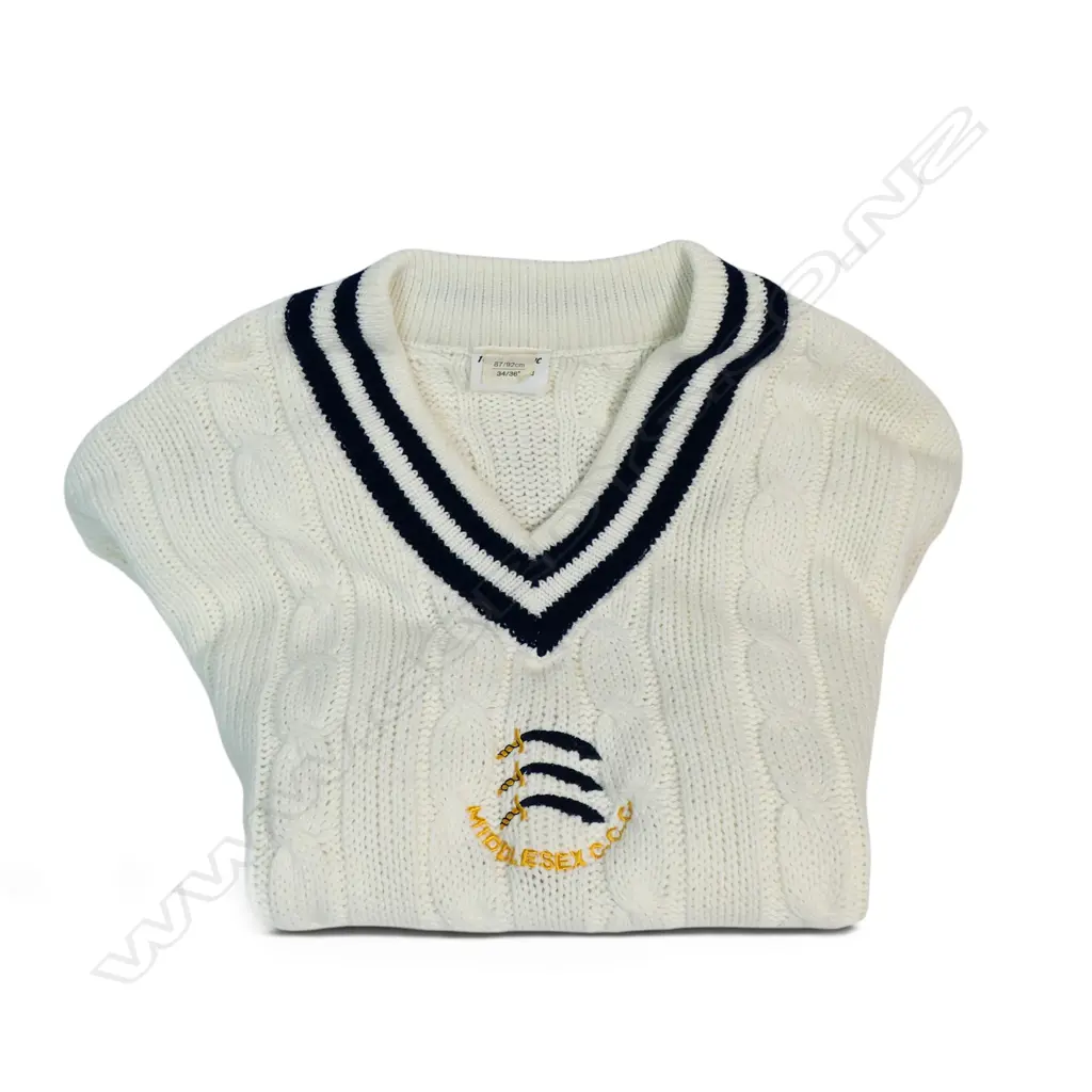An unused MCC player jersey - identified as a 'player ' garment by the emblem directly centred below the V neck, Image 1++