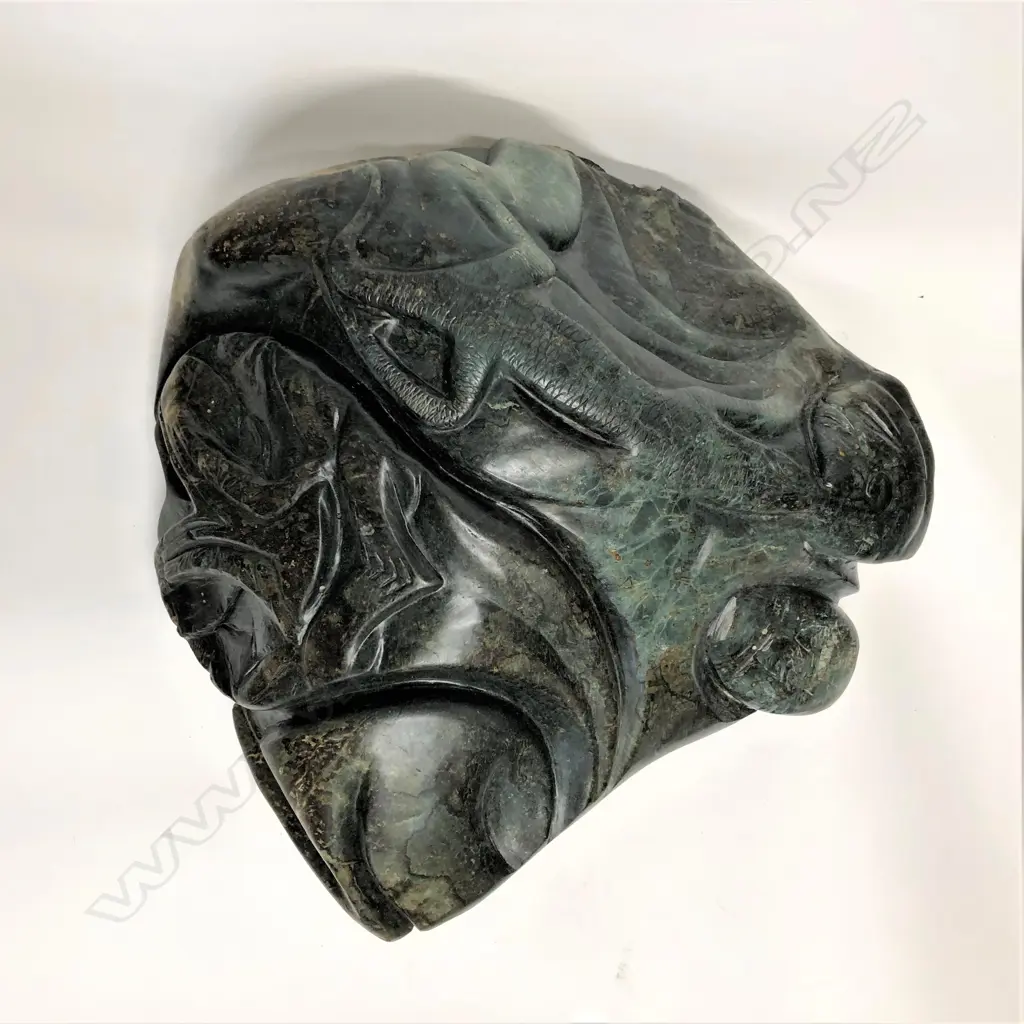 A large dark green pounamu carved boulder bowl Image 1++