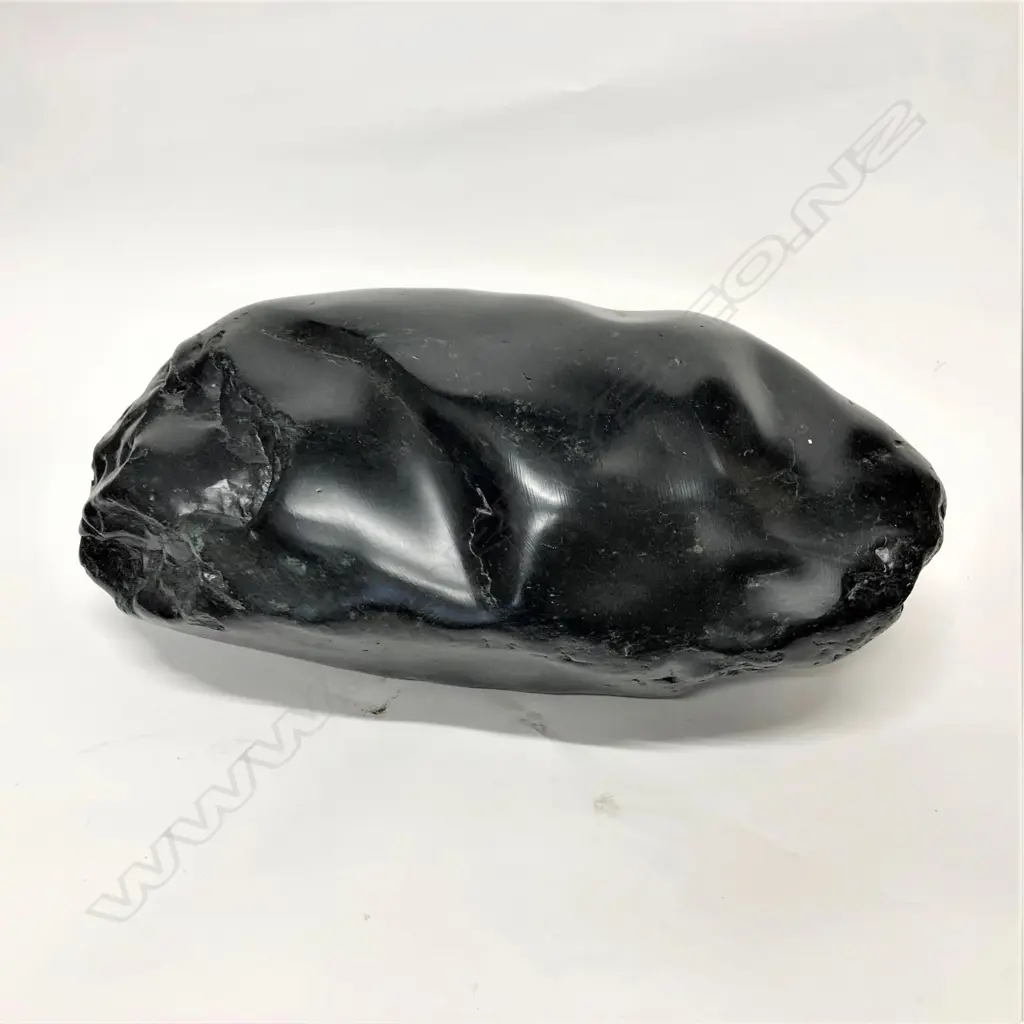 A dark green pounamu boulder Image 1++