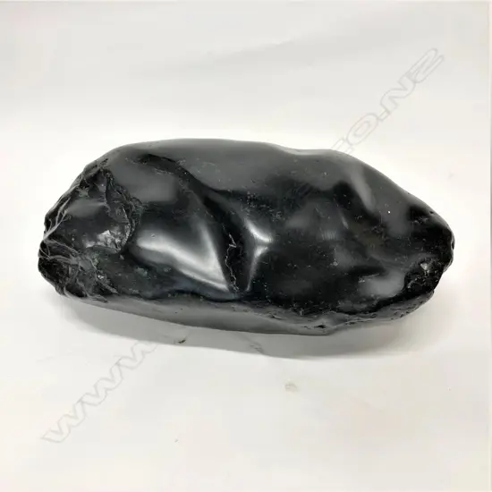 A dark green pounamu boulder