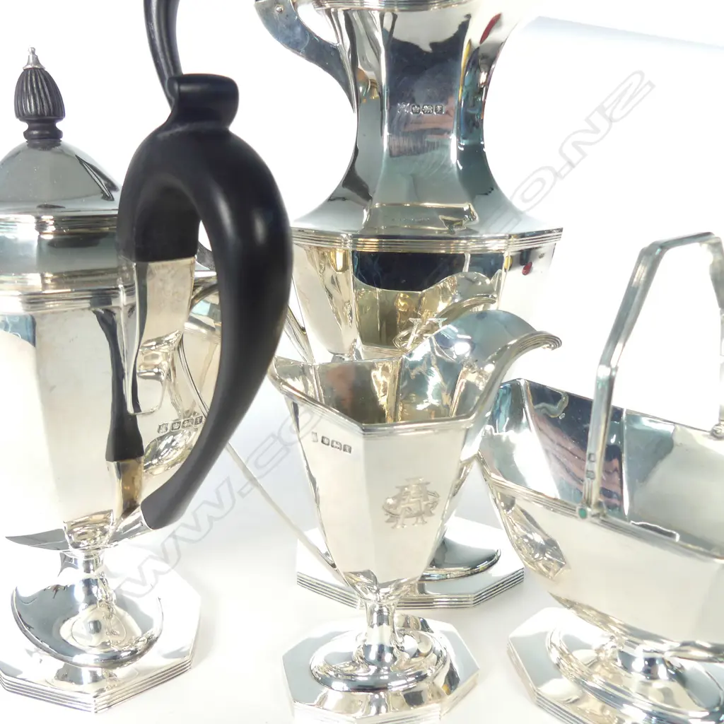 A sterling silver four piece tea set Image 1++