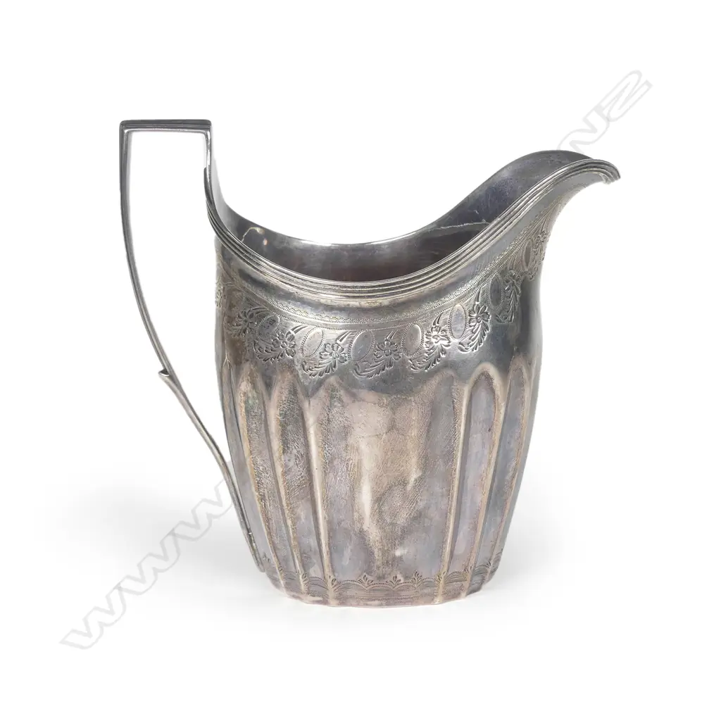 A George III silver flat bottomed cream jug Image 1++