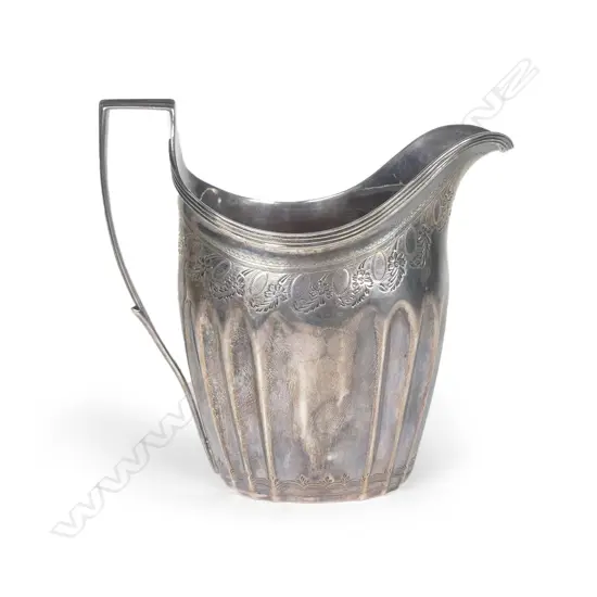 A George III silver flat bottomed cream jug
