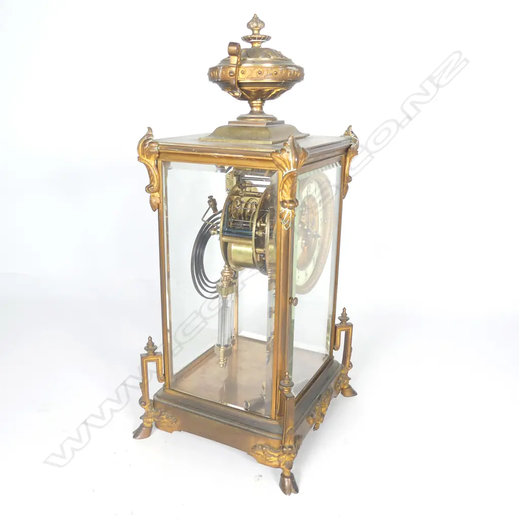 A French brass four glass two train mantel clock Image 1++