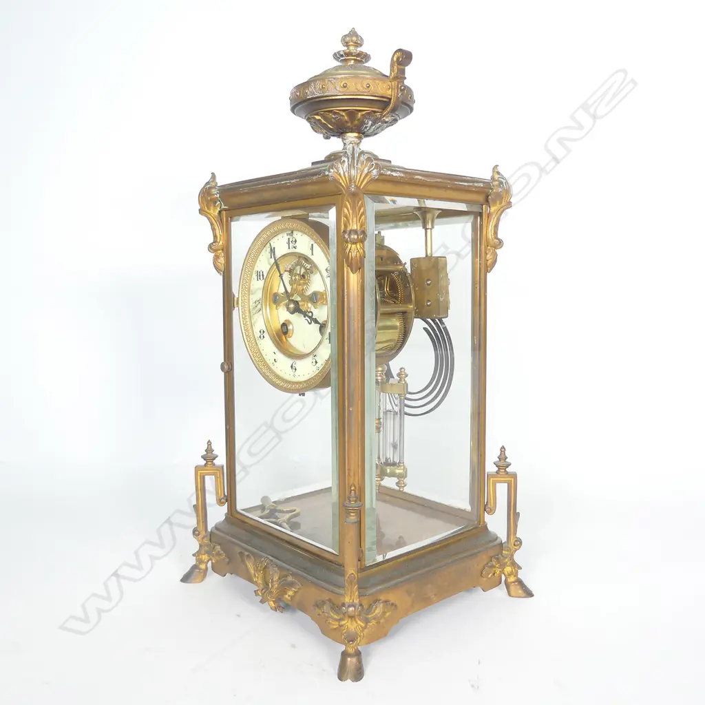 A French brass four glass two train mantel clock Image 1++