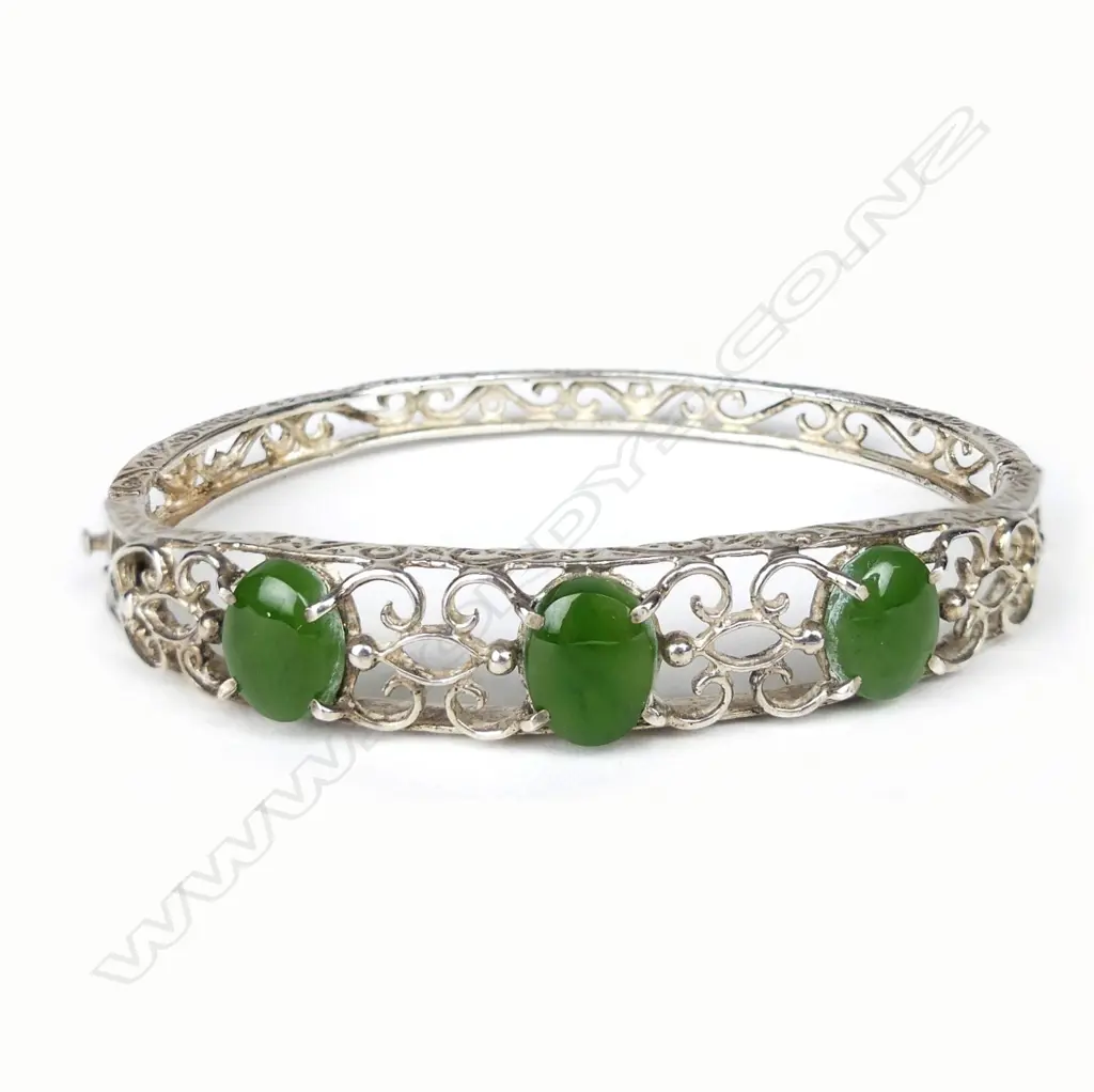 A silver and pounamu hinged bangle Image 1++