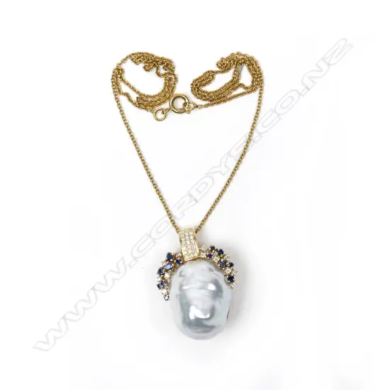 An impressive 18ct. gold baroque pearl and diamond pendant