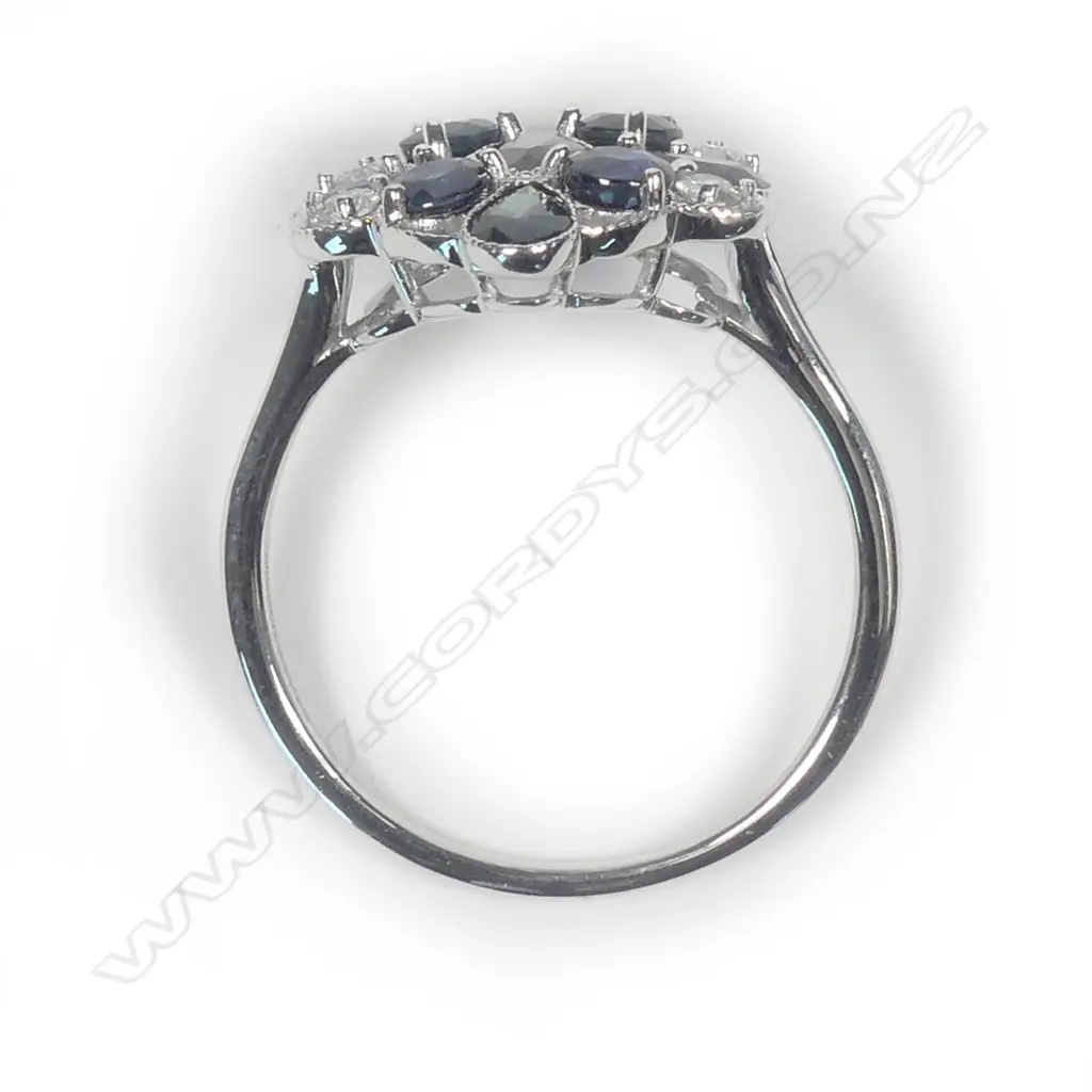 A 14ct white gold sapphire and diamond ring Image 1++