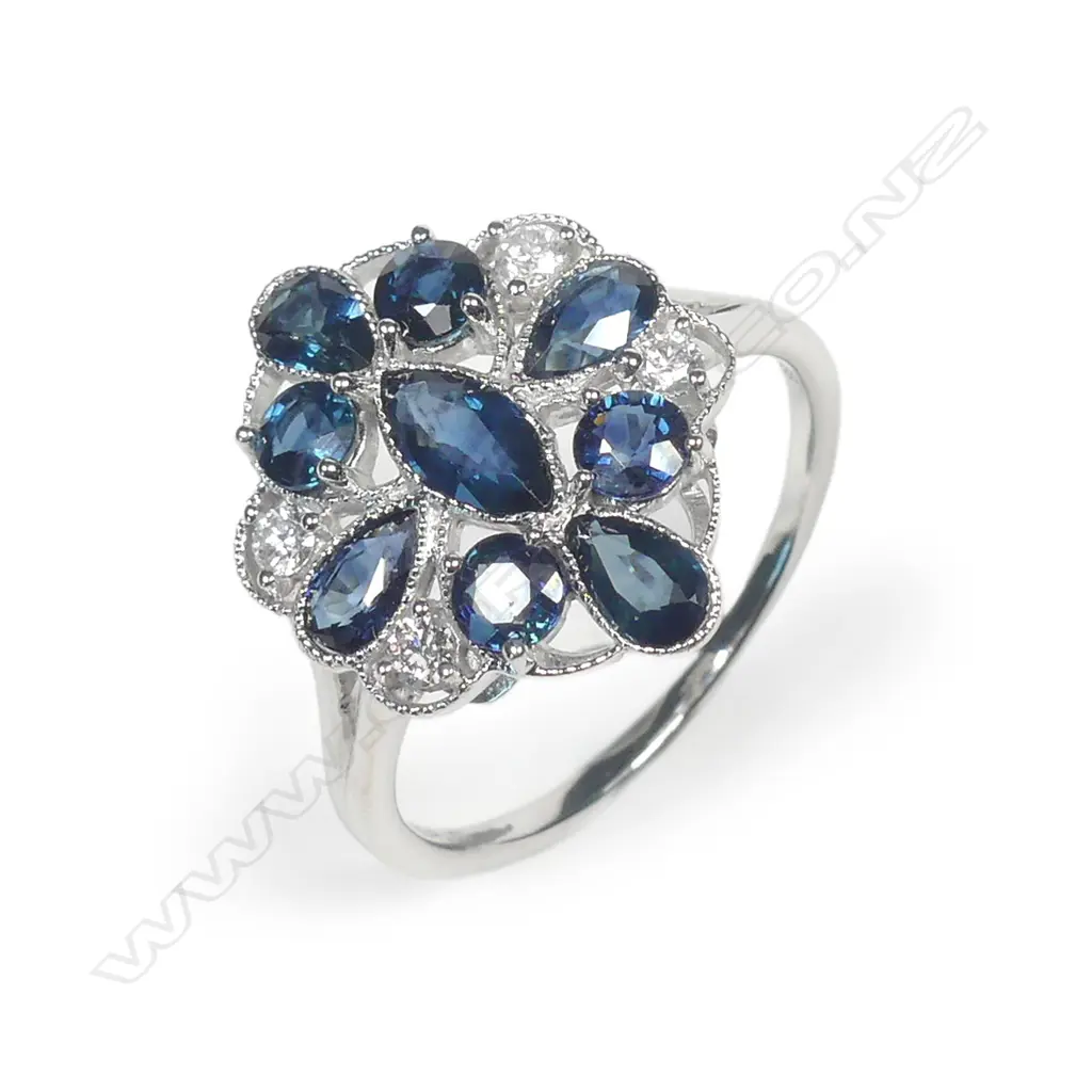 A 14ct white gold sapphire and diamond ring Image 1++