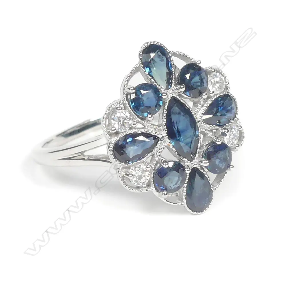 A 14ct white gold sapphire and diamond ring Image 1++