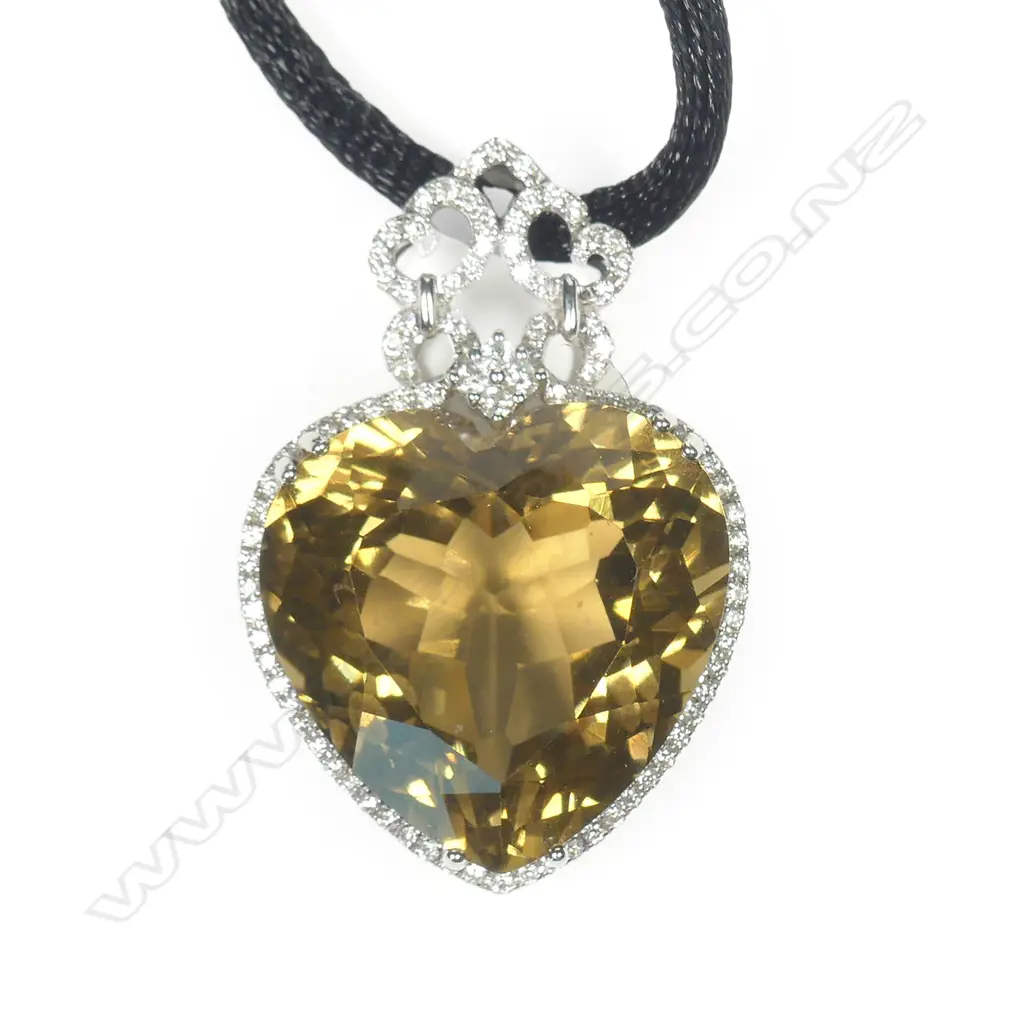 An impressive 18ct white gold yellow topaz and diamond pendant Image 1++