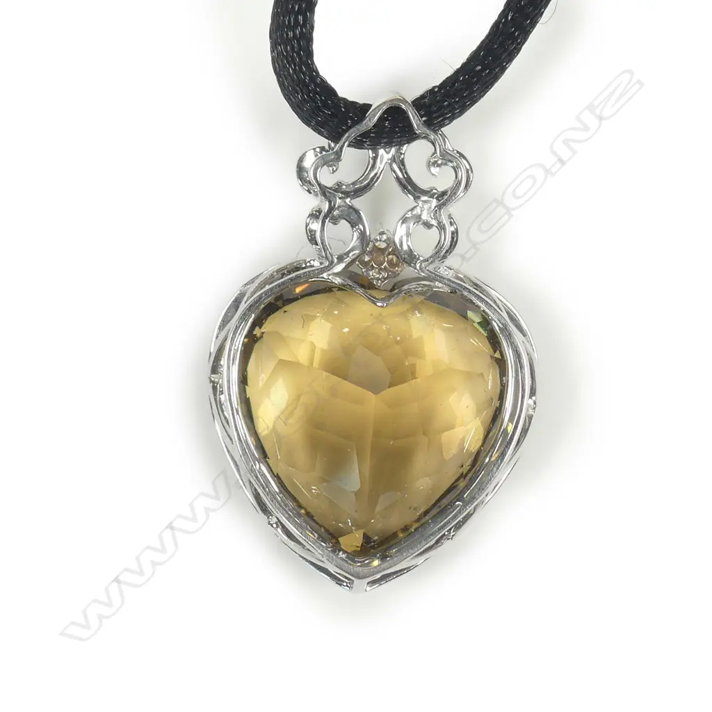 An impressive 18ct white gold yellow topaz and diamond pendant Image 1++