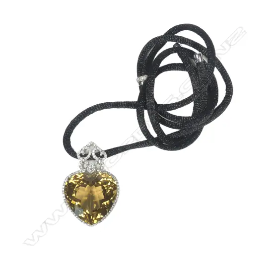 An impressive 18ct white gold yellow topaz and diamond pendant