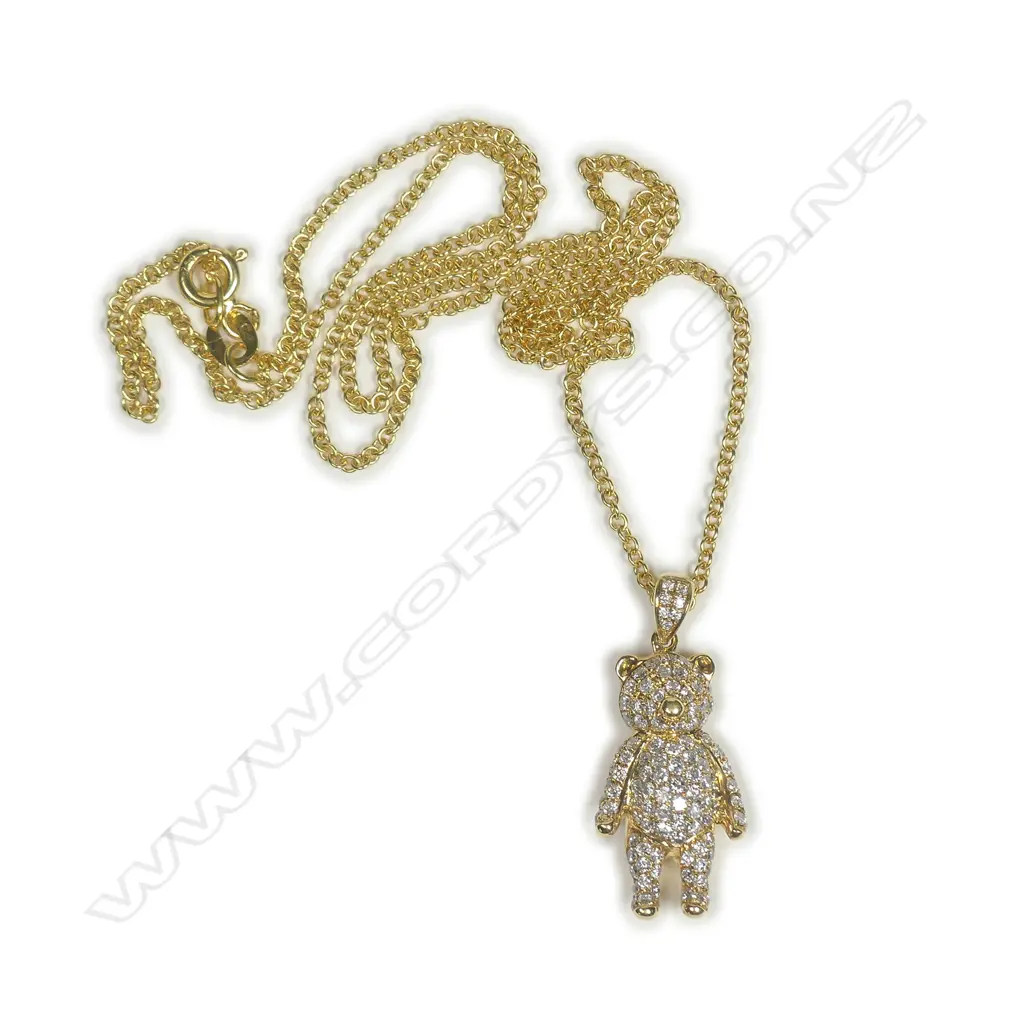 An 18ct yellow gold and diamond set teddy bear pendant on 18ct chain Image 1++